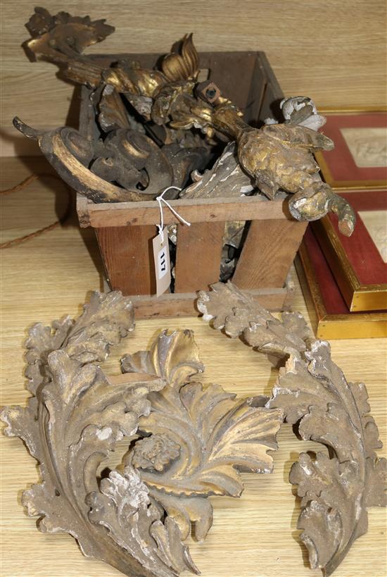 A box of antique giltwood carvings